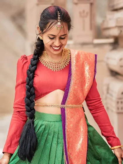 A happy, candid shot of the model, capturing the vibrant colors and youthful energy of the outfit.