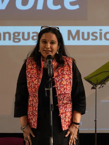 A participant delivering her poem with passion and poise at the showcase event. We teach you how to use your voice and presence to make your words resonate.