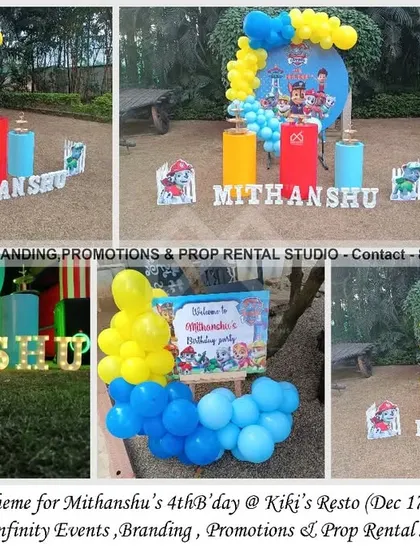 No job is too big, no pup is too small! This Paw Patrol theme for a 4th birthday at Kiki's Resto is ready for action. The simple outdoor setup includes a character backdrop, a colorful balloon garland, and themed cylinder props.