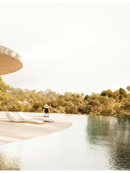 The infinity pool at Amar Villa creates a stunning visual connection between the architecture and the distant mountains.