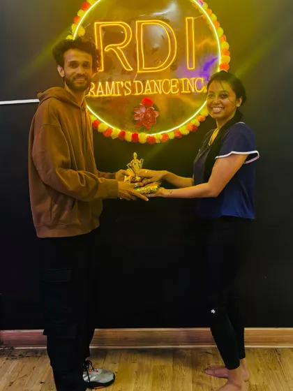 A participant receiving a trophy for her excellent Garba skills. We make learning a fun and rewarding experience for everyone involved.