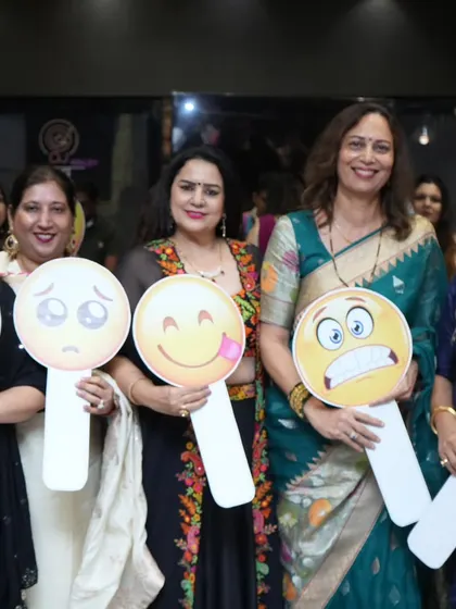 An emoji-themed game at a ladies' party. These props add a fun visual element to the games and make for great photos.