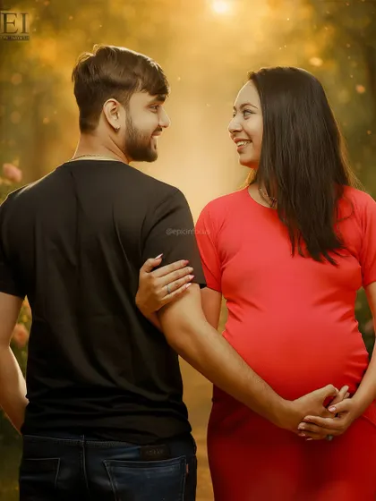 A candid glance shared between the expecting couple during their outdoor photoshoot. These unscripted moments capture the genuine love and anticipation.