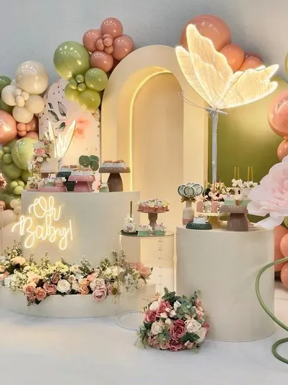 A duplicate of the custom "Oh Baby" party with a butterfly theme, showcasing the intricate details and beautiful composition of the dessert table area.