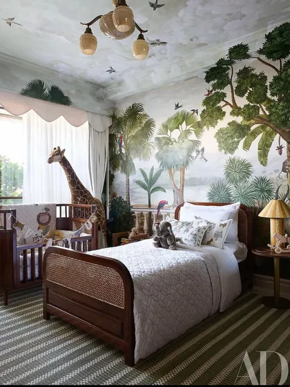 A wider view of Vayu's room, showing how the crib and toddler bed are positioned to feel like part of the jungle landscape. I'm so grateful this project was featured in Architectural Digest.