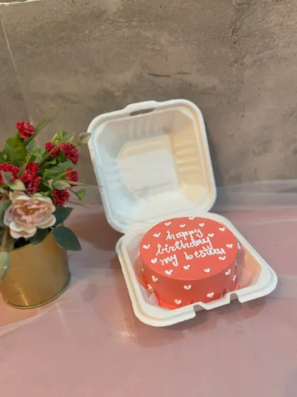 A "Happy Birthday my besty" bento cake in a lovely coral color.