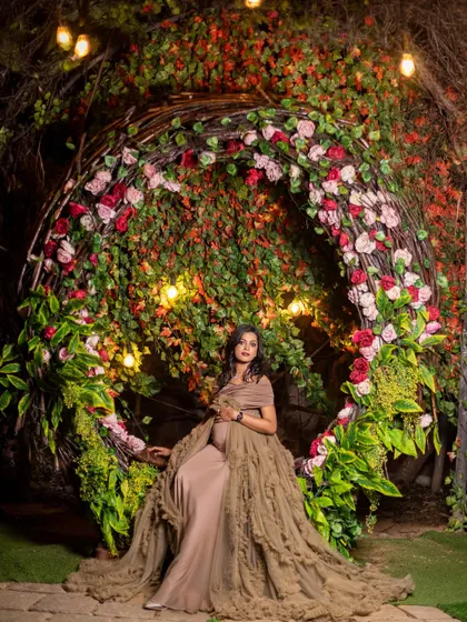 The same floral nest prop, used to create a stunning solo portrait of the mom-to-be, looking like a queen on her throne.