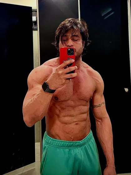 A confident pose showing off a lean and muscular midsection. My programs are designed to help you lose fat while building or retaining muscle.