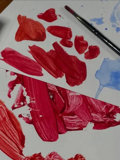 Swatches of red, searching for the perfect shade. The process of colour mixing is an art in itself.