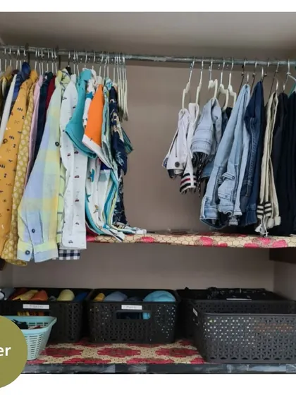 The "after" of the kids' wardrobe. We hung up shirts, used baskets to categorize folded clothes, and created a system that is easy for a child to help maintain.