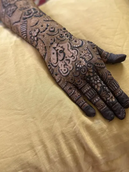 This is a detailed view of my intricate bridal henna work. Each design is unique, combining traditional patterns like paisleys and mandalas with fine-line fillers to create a stunning, full-coverage look for your special day.