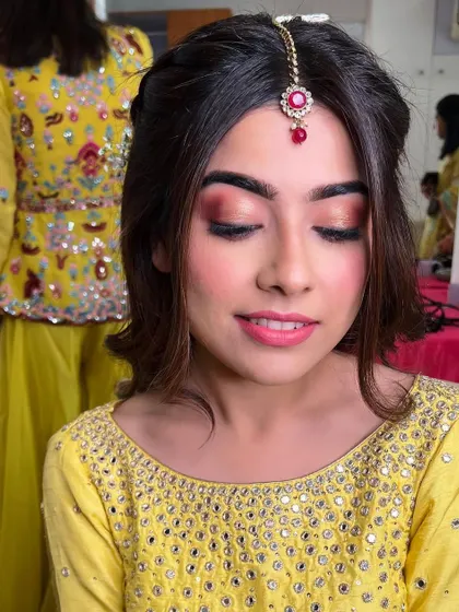 Another view of the soft pink eye makeup. This look is perfect for brides who want a touch of color without it being too heavy.