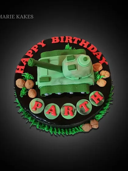 A birthday cake for a fan of "boy toys". This chocolate cake is topped with a hand-sculpted fondant army tank, ready for action.