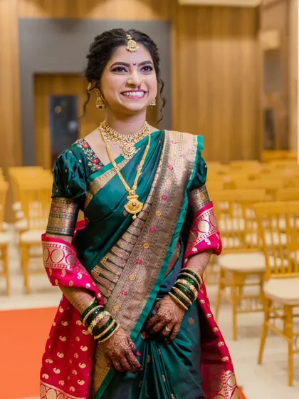 A beautiful portrait of the bride in the wedding hall before the ceremony begins, her smile full of excitement.
