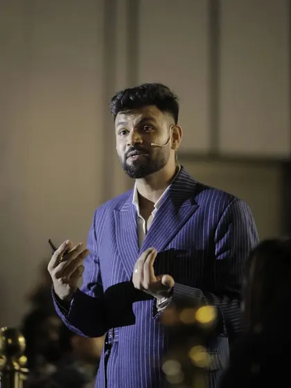 Our client, a public speaker, relies on our suits to look his best. This pinstripe jacket is designed for comfort and style, ensuring he looks sharp and feels confident under the lights.