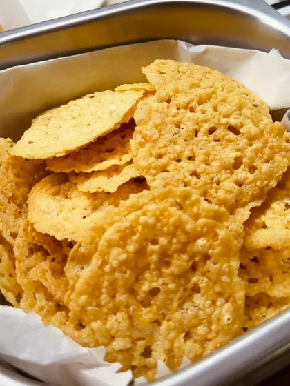 A tray of freshly made mathri, a crispy, savoury cracker, waiting to be used as a component in one of our inventive chaat dishes.