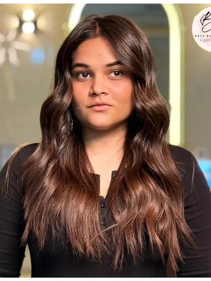 A full look at this sparkling brown hair transformation. The color is rich and dimensional, giving her a crown of confidence she can wear every day.