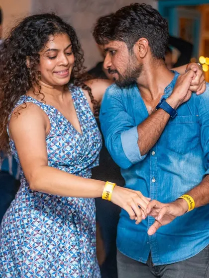 A close and focused dance, showing great partner connection.