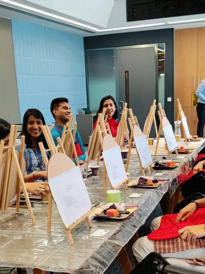 The setup for the workshop at Google, with individual easels ready for each participant. Creating a professional and inspiring environment is key to a successful art session.