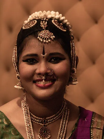 The bright smile of a performer, reflecting the joy of dance.