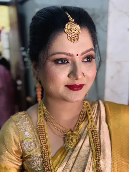 A portrait shot that captures the elegance of the makeup. This is a perfect example of a guest makeup look that is both traditional and sophisticated.