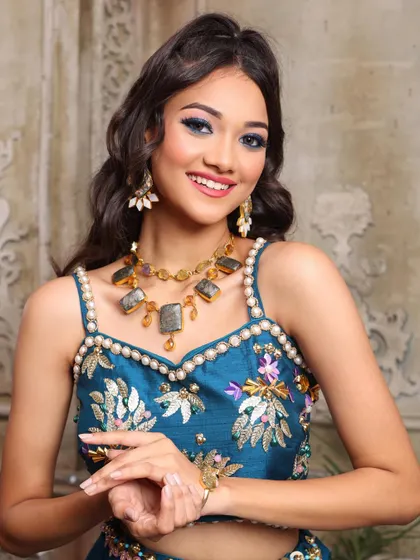 A close-up of the colorful yet harmonious makeup. You'll learn how to balance bold colors for a stunning result.