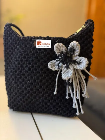 The same square knot bag design, but in black with a grey and black flower. It's amazing how changing the colors gives it a completely different vibe!