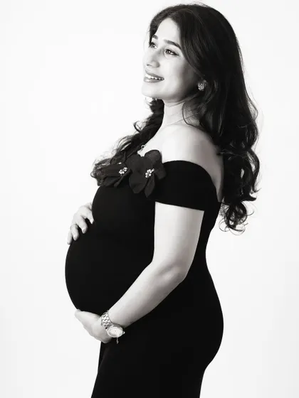 Black and white photography adds a timeless, emotional quality to maternity portraits. It strips away distractions and focuses on the pure form and feeling of the moment.