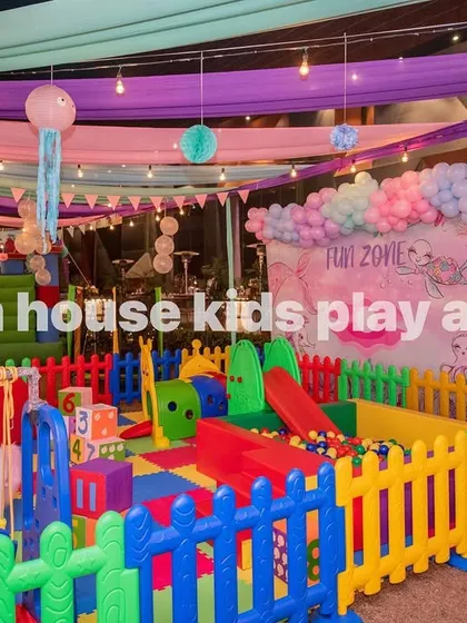 Our 14x14 rainbow play area set up under festive decorations, creating a perfect party atmosphere.