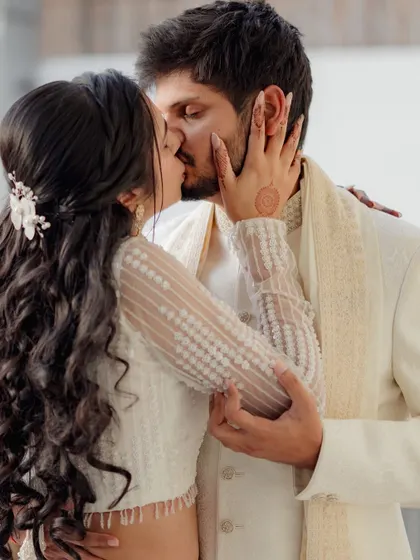 A passionate kiss shared by the newly engaged couple, Sunaina and Vivek, a perfect capture of their love and excitement.