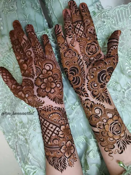 A lovely pair of hands adorned with different but complementary designs. This is a great option for bridesmaids or family members.
