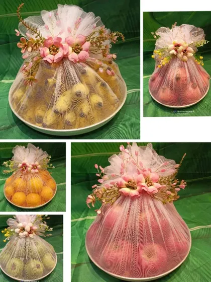 A collage showing how I pack and decorate different fruit platters. Each platter is wrapped in delicate netting and topped with flowers, ready for gifting.