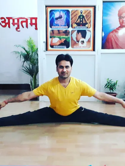 A demonstration of Upavistha Konasana (Wide-Angled Seated Forward Bend), a deep stretch for the hamstrings and inner thighs. Flexibility is a key component of our training.