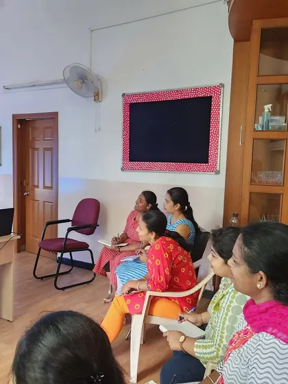 Our teachers listening to the presentation, focused on learning new techniques to support their students' behavioral and communicative development.