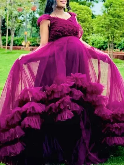 I have over 200 designs for your special moments. This wine-colored ruffle gown is a fantastic option for a baby shower function or a maternity photoshoot.