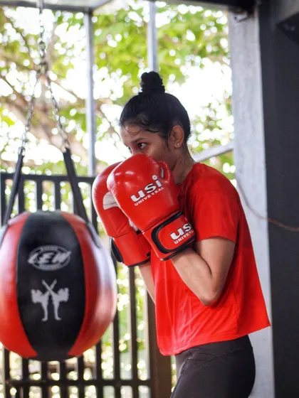 Working the slip bag to practice slipping punches and countering. This drill builds the muscle memory needed for effective defense.