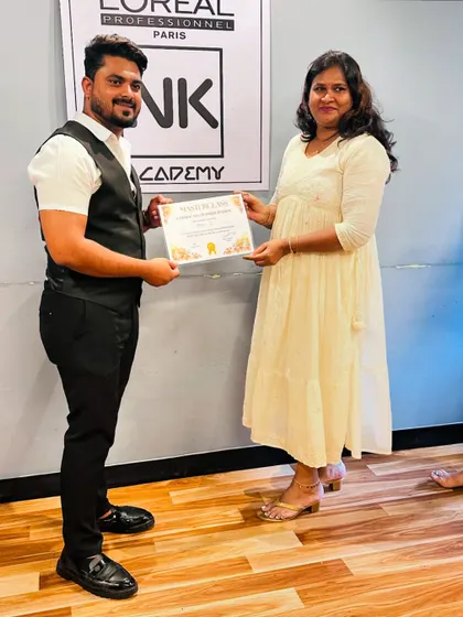 I believe in always learning. Here I am receiving my master class certificate for permanent hair extensions from my mentor, Navin Kumar sir.