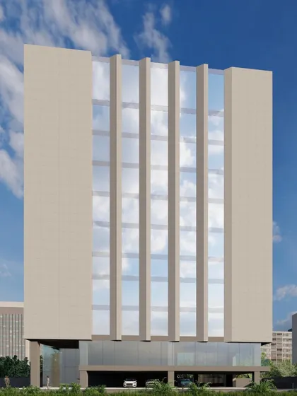 This perspective of the climate-responsive facade shows the ground-level parking integrated beneath the main building mass. This functional choice elevates the primary office floors and contributes to the building's clean, modern aesthetic.