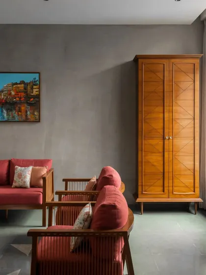 We incorporated the client's heritage through subtle details. The pattern on this wooden wardrobe is inspired by the geometric designs of Phulkari, the traditional embroidery of Punjab, making the furniture a piece of personal history.