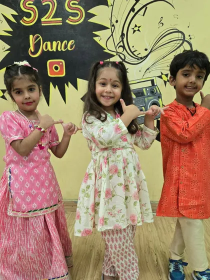 Three little dancers posing in their lovely ethnic outfits during our Janmashtami festivities.