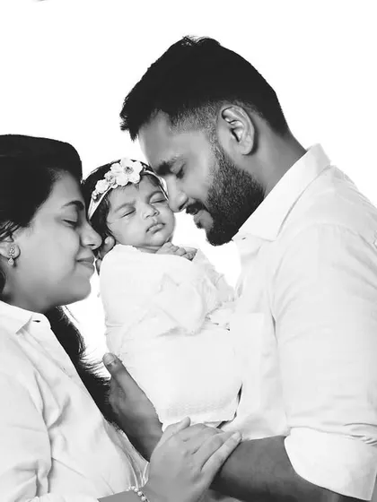 A black and white version of the family portrait, which adds a timeless and emotional quality to the image.