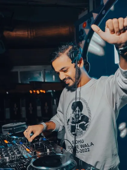 A happy moment at the decks, feeling the energy from the music and the crowd.