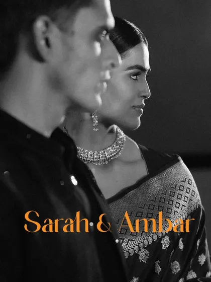An artistic, black and white portrait of a couple. The side profile and dramatic lighting give this shot a very chic, editorial, and timeless feel, perfect for a couple who appreciates fine art.