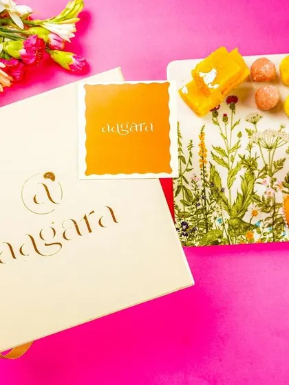 A wider shot of the festive flatlay, showing the beautiful gift box and branding. This is great for showcasing a complete gifting solution.