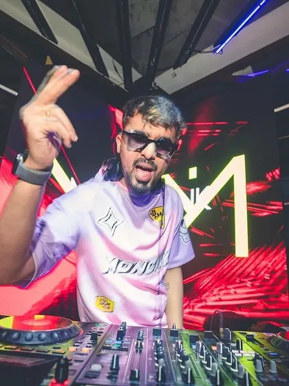 A cool, confident pose for the camera while at the decks. It's all about bringing a positive and fun personality to the party.