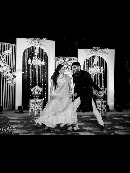 The couple sharing a dance on stage during their Sangeet performance.
