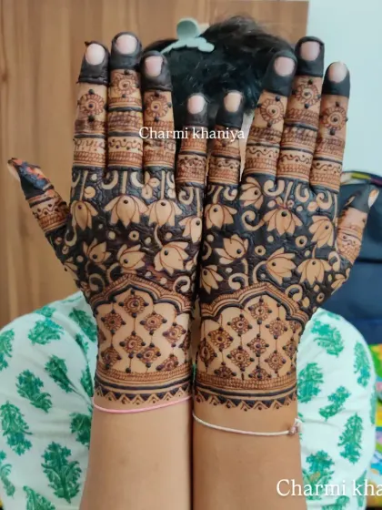 A full hand of blooming lotuses! This design uses negative space to make the lotus motifs pop, creating a bold and beautiful floral pattern that is perfect for any celebration.