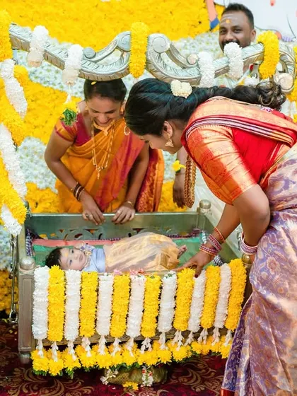 The cradle ceremony is a beautiful tradition. I capture the moment the baby is placed in the cradle, surrounded by smiling family members.