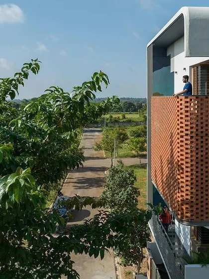 A view from the balcony of 'House Belaku', looking out through the protective yet porous brick screen.