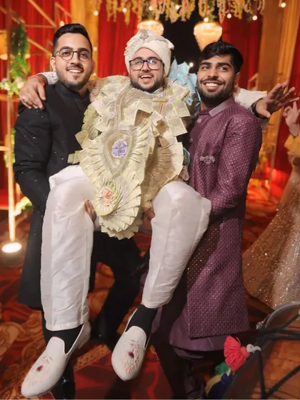 The groom celebrating with his closest friends. These are the moments of brotherhood and fun that add another layer to the wedding day story.